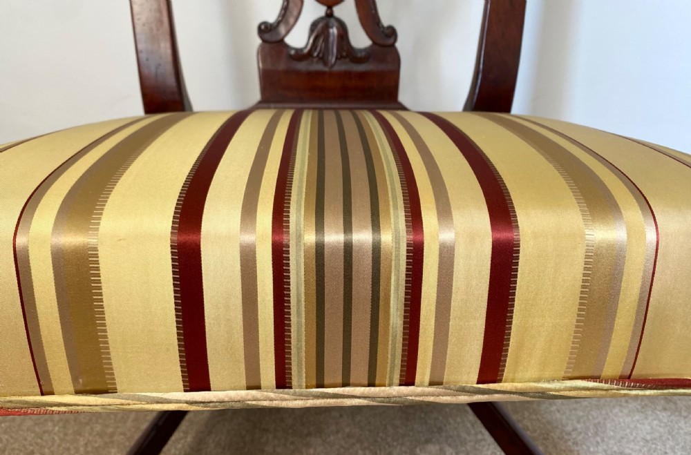 A dark walnut Georgian side chair featuring an intricately carved ribbon-back splat and a gold and red striped upholstered seat. View III