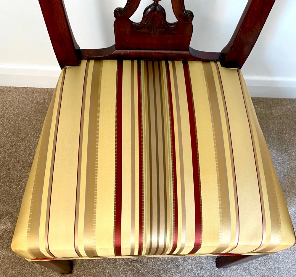 A dark walnut Georgian side chair featuring an intricately carved ribbon-back splat and a gold and red striped upholstered seat. View IV