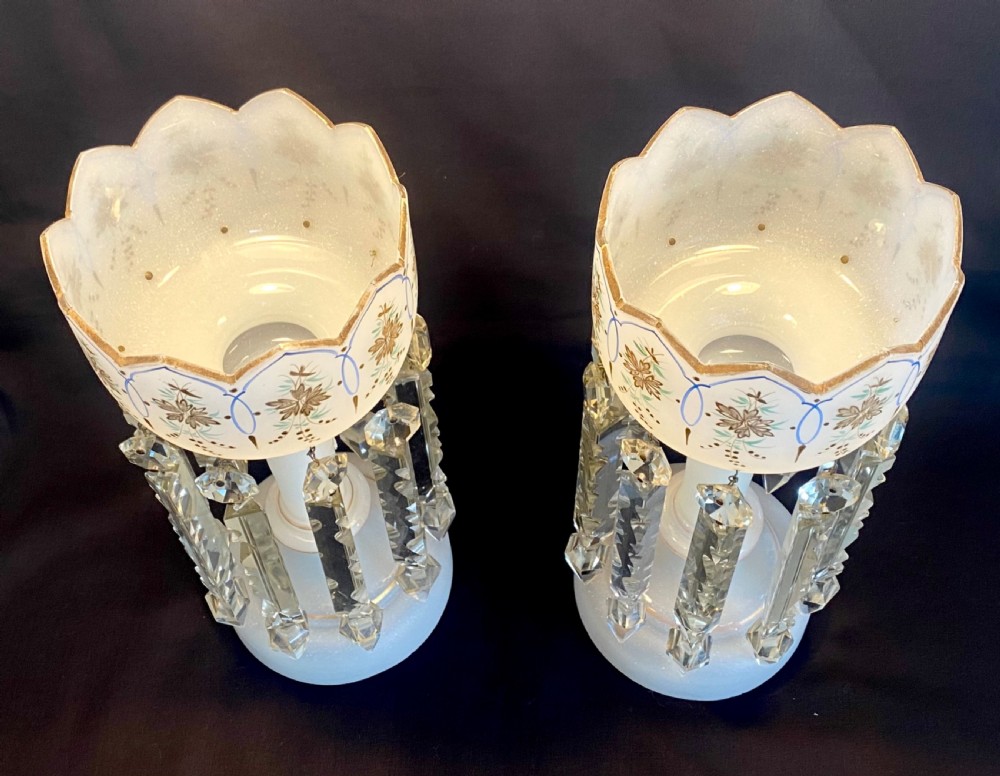 A pair of frosted white French opaline glass table lustres featuring crenellated rims, gilded floral motifs, and suspended clear cut-crystal drop prisms. View II