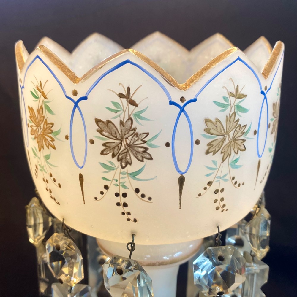 A pair of frosted white French opaline glass table lustres featuring crenellated rims, gilded floral motifs, and suspended clear cut-crystal drop prisms. View III
