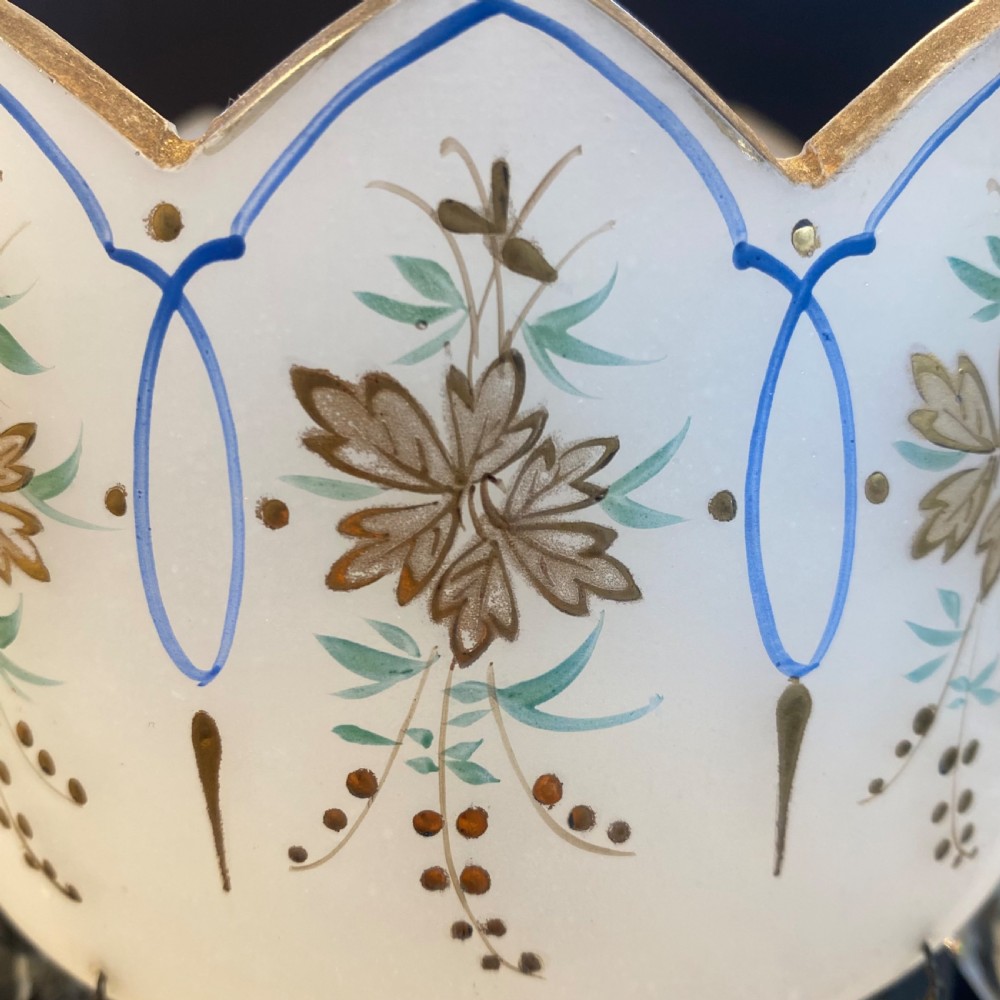 A pair of frosted white French opaline glass table lustres featuring crenellated rims, gilded floral motifs, and suspended clear cut-crystal drop prisms. View VII