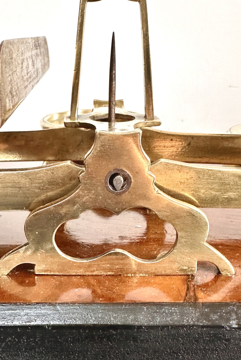 Victorian brass postal scales mounted on a dark mahogany wooden base with turned feet, including a set of nested brass weights. View VIII