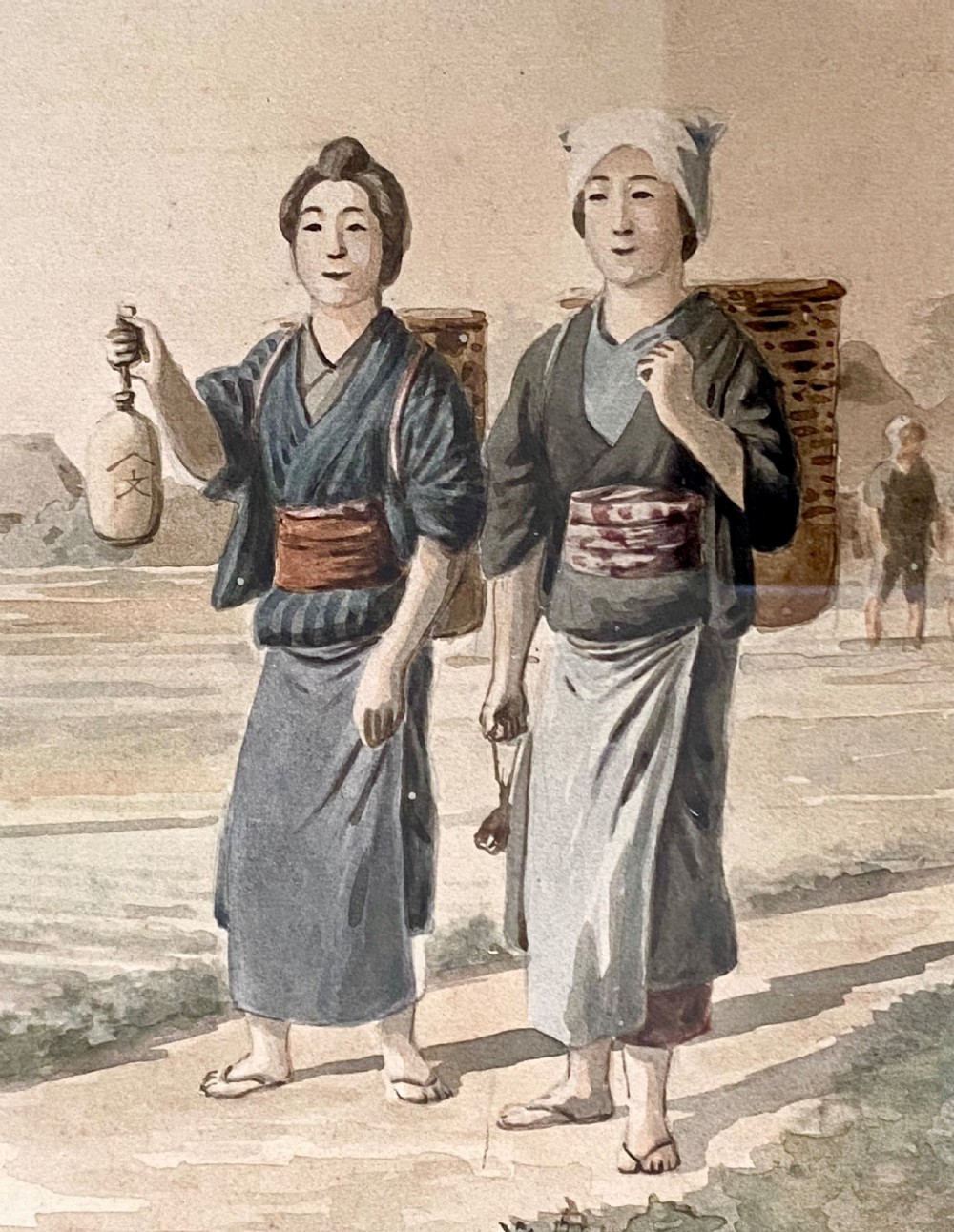 A pair of framed Japanese watercolour paintings depicting figures in traditional clothing set within dark faux-bamboo wooden frames and pale blue mounts. View VI