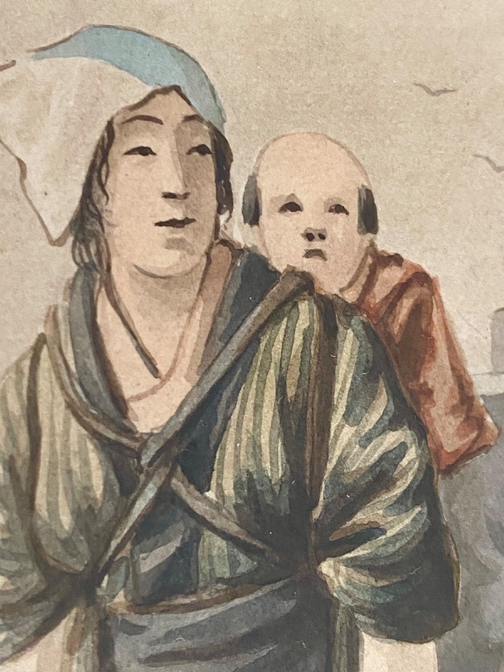 A pair of framed Japanese watercolour paintings depicting figures in traditional clothing set within dark faux-bamboo wooden frames and pale blue mounts. View XII