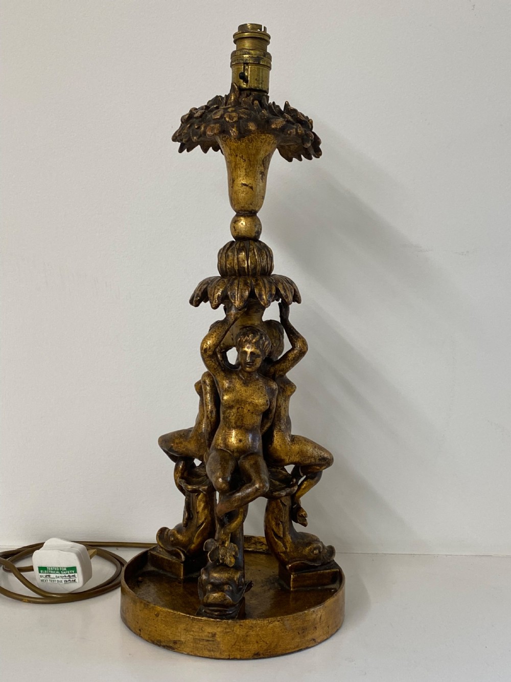 A pair of ornate Italian carved gilded table lamps featuring sculpted female figure supports and floral columns. View II