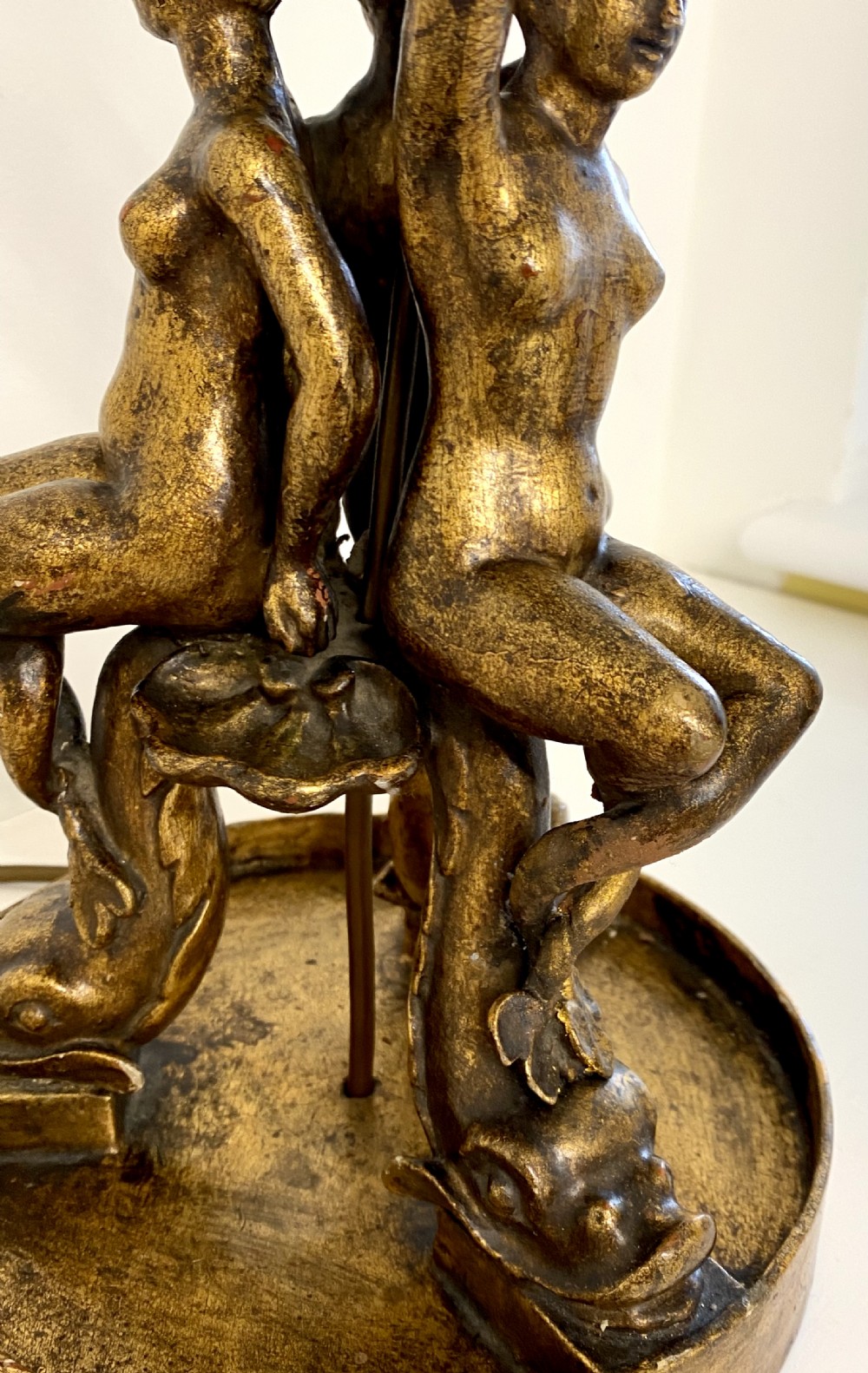 A pair of ornate Italian carved gilded table lamps featuring sculpted female figure supports and floral columns. View VI