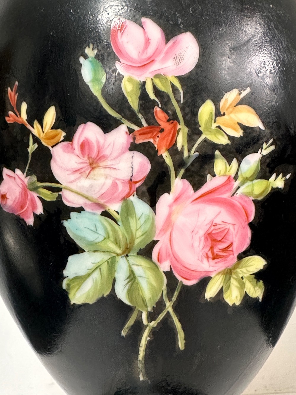 A black French porcelain goblet vase featuring gilt handles, a flared pedestal base, and a central painted medallion depicting a classical figure labelled Le Soir. View VIII