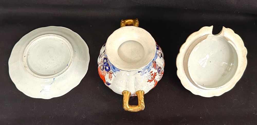 An antique Victorian Masons ironstone sauce tureen with matching stand, decorated in Imari floral enamel patterns with gilded scroll handles. View II