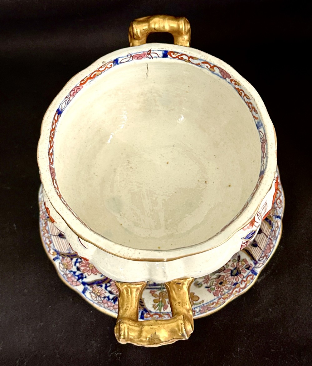 An antique Victorian Masons ironstone sauce tureen with matching stand, decorated in Imari floral enamel patterns with gilded scroll handles. View V