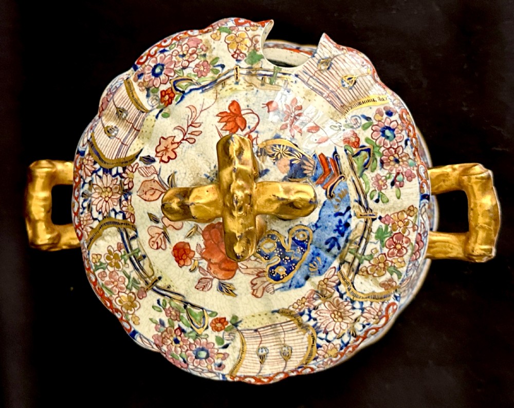 An antique Victorian Masons ironstone sauce tureen with matching stand, decorated in Imari floral enamel patterns with gilded scroll handles. View VI