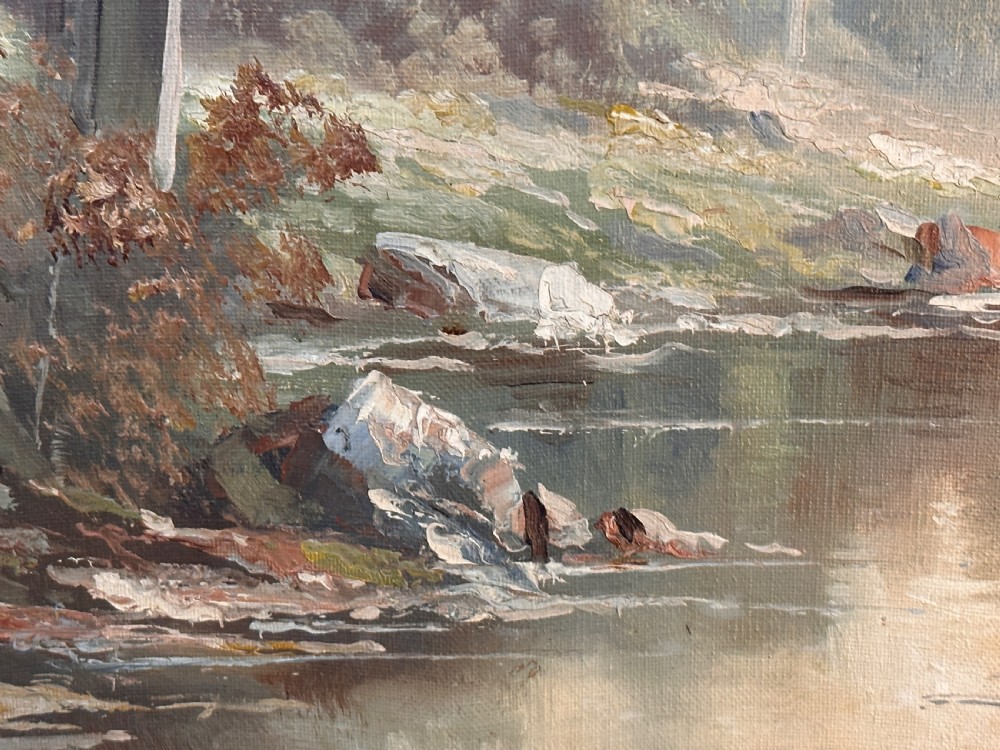 An antique landscape oil painting depicting a calm river flowing through a dense forest, housed in an ornate gilded frame. View IV