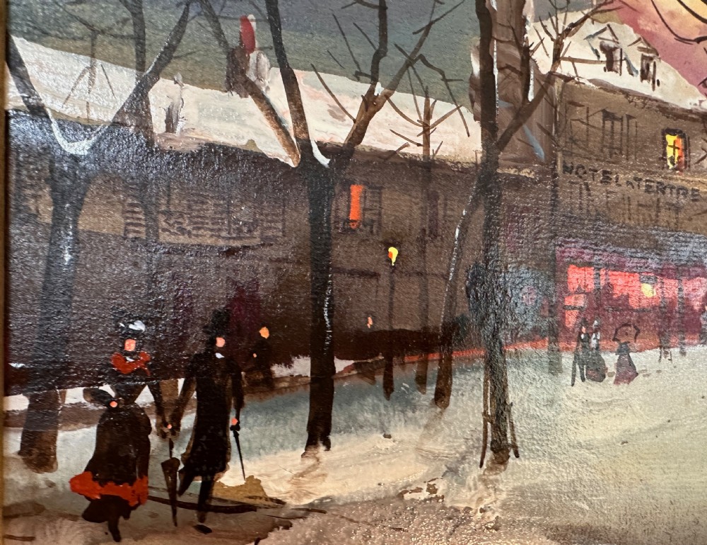 An oil painting on board depicting a snowy winter evening in Place du Tertre, Montmartre, mounted in a carved gilt frame with a blue inner slip. View V
