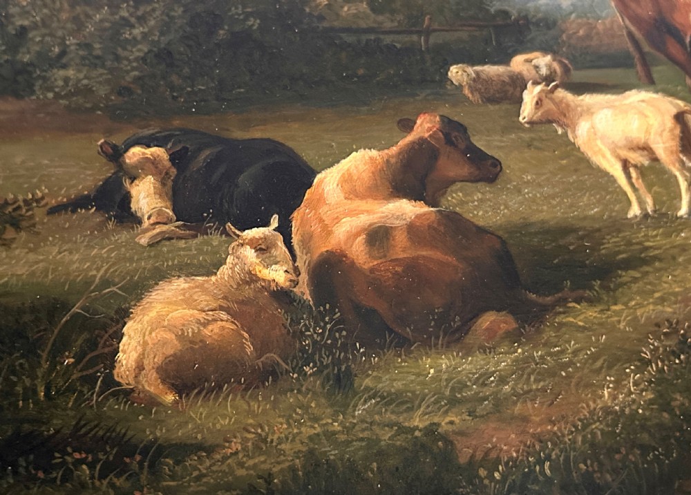 An oil painting on canvas depicting livestock resting in a pastoral field, housed within an ornate gold gilt frame. View V