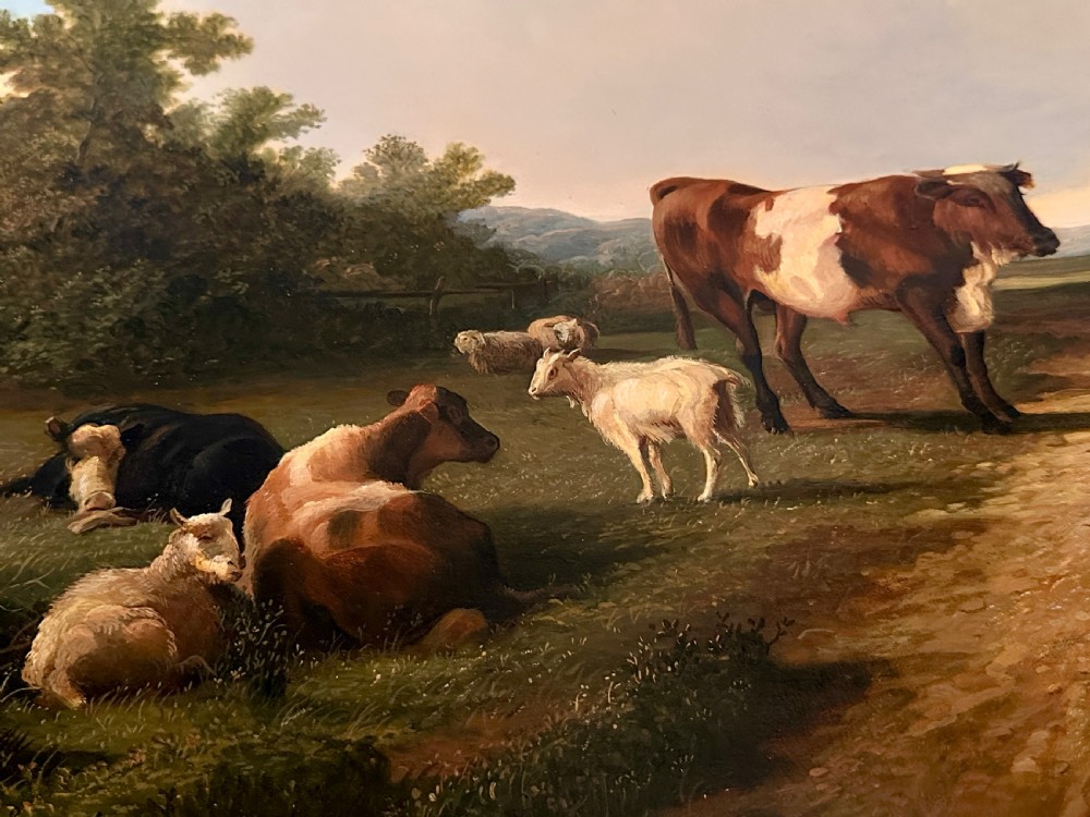 An oil painting on canvas depicting livestock resting in a pastoral field, housed within an ornate gold gilt frame. View VI