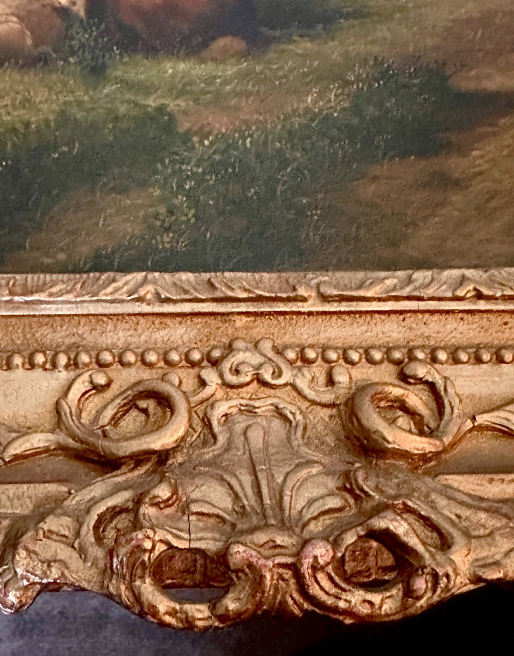 An oil painting on canvas depicting livestock resting in a pastoral field, housed within an ornate gold gilt frame. View VII