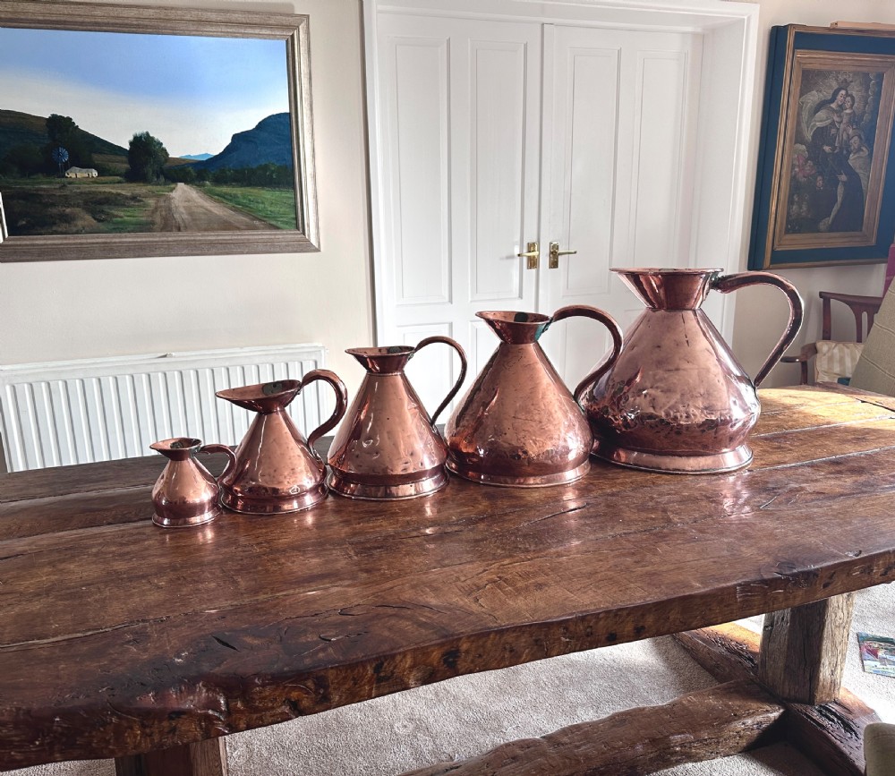 Copper Measuring Jugs of Large Proportion View II