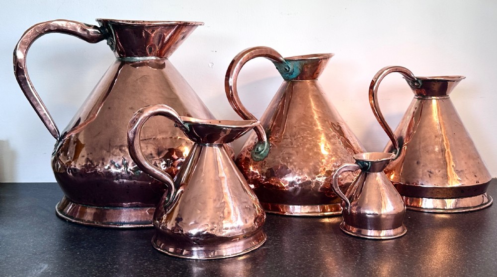 Copper Measuring Jugs of Large Proportion