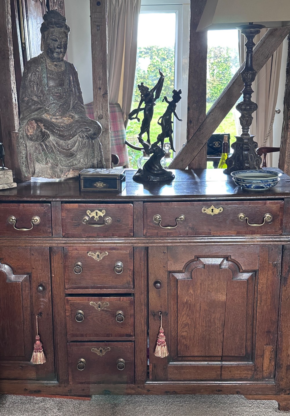 A dark patinated bronze sculpture depicting two dancing nymphs with flowing drapery set on a swirling base inscribed with La Danse des Nymphes. View XI