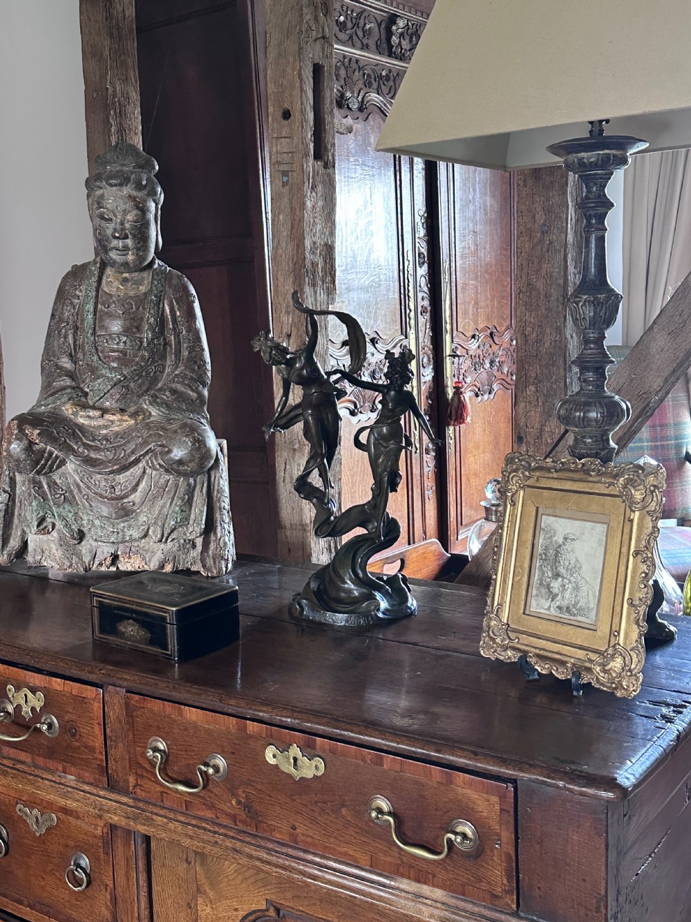 A dark patinated bronze sculpture depicting two dancing nymphs with flowing drapery set on a swirling base inscribed with La Danse des Nymphes. View XII