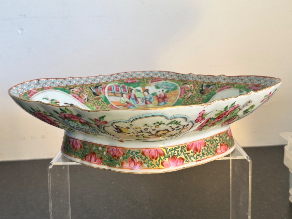 A 19th-century Chinese Canton export porcelain pedestal dish featuring hand-painted famille rose enamels with central figure scenes and floral motifs. View III