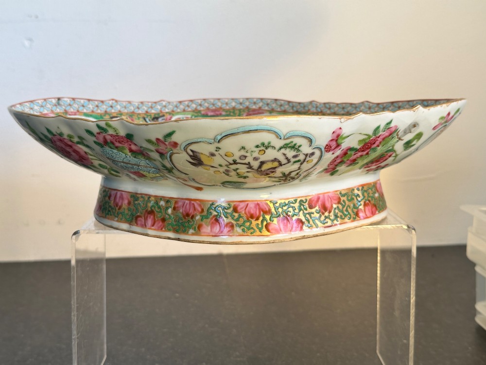 A 19th-century Chinese Canton export porcelain pedestal dish featuring hand-painted famille rose enamels with central figure scenes and floral motifs. View IV
