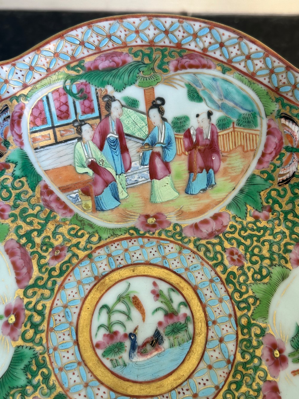 A 19th-century Chinese Canton export porcelain pedestal dish featuring hand-painted famille rose enamels with central figure scenes and floral motifs. View VI