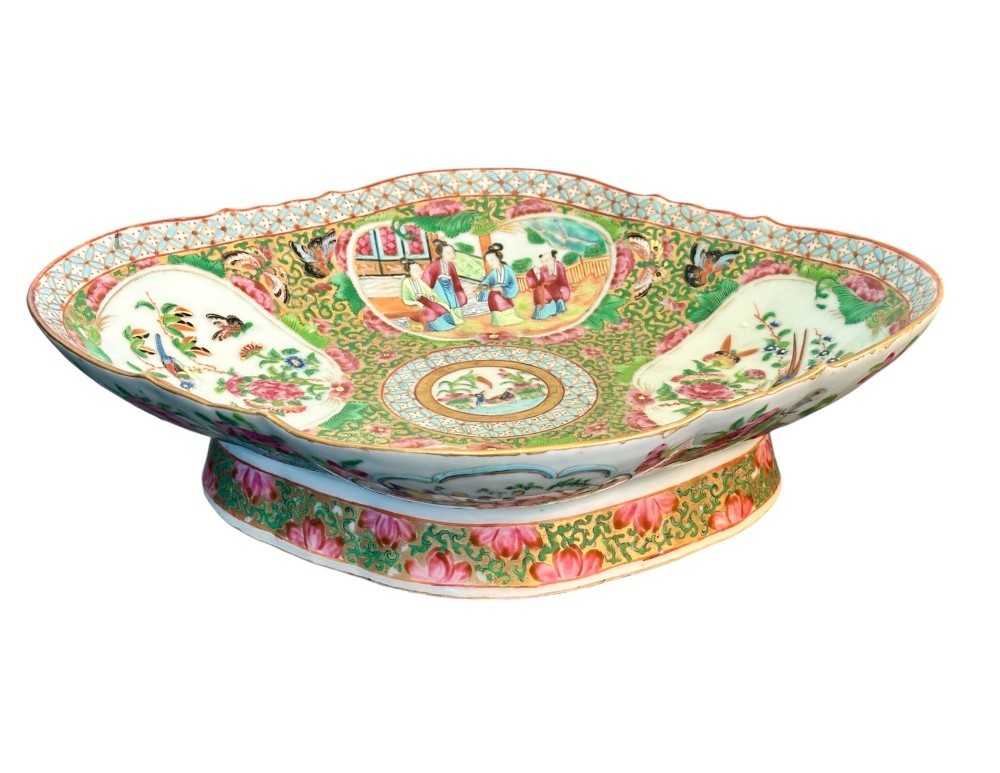 A 19th-century Chinese Canton export porcelain pedestal dish featuring hand-painted famille rose enamels with central figure scenes and floral motifs. View VIII
