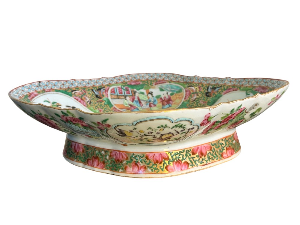 A 19th-century Chinese Canton export porcelain pedestal dish featuring hand-painted famille rose enamels with central figure scenes and floral motifs. View IX