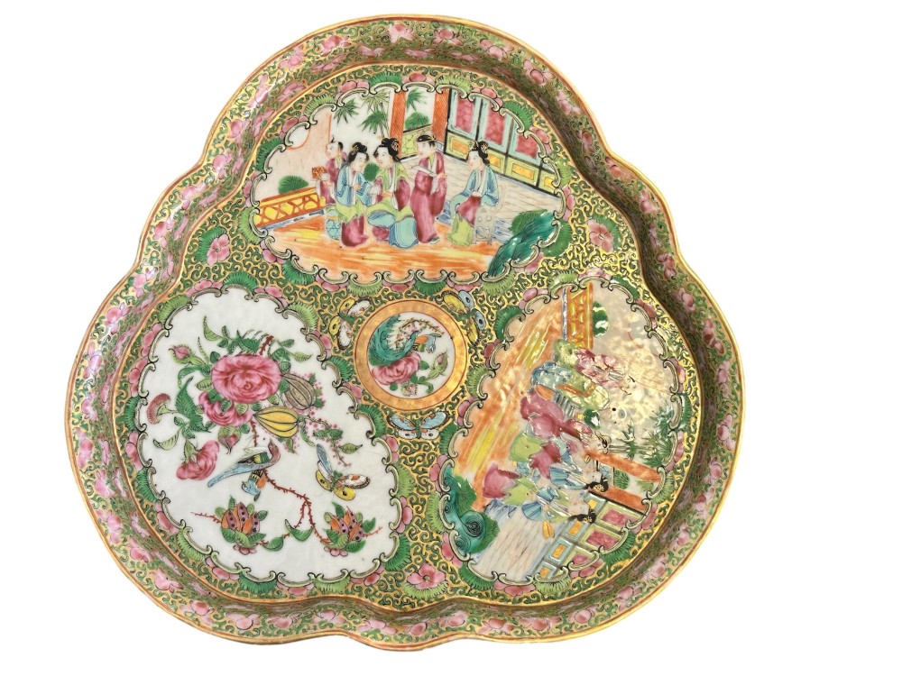 A 19th-century Chinese Canton trefoil porcelain dish decorated with polychrome enamel panels of figures, birds, butterflies, and floral motifs surrounded by gilded borders.