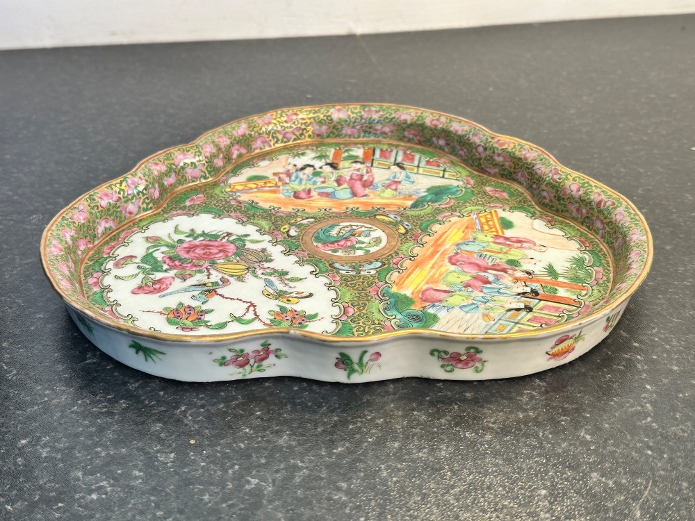 A 19th-century Chinese Canton trefoil porcelain dish decorated with polychrome enamel panels of figures, birds, butterflies, and floral motifs surrounded by gilded borders. View II