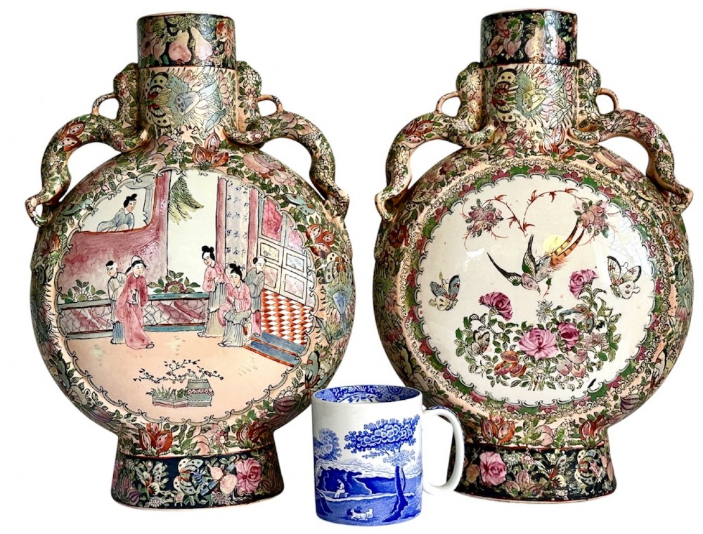 A pair of Chinese Famille Rose porcelain moon flasks featuring circular reserves with painted bird, floral, and figure scenes surrounded by dense enamel borders and dragons. View II