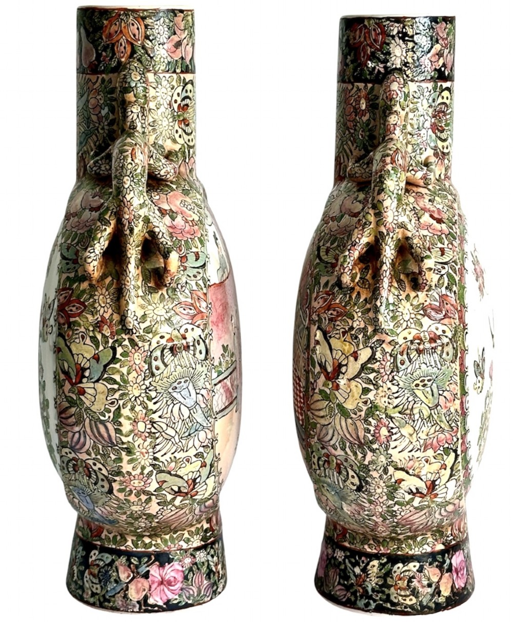 A pair of Chinese Famille Rose porcelain moon flasks featuring circular reserves with painted bird, floral, and figure scenes surrounded by dense enamel borders and dragons. View III