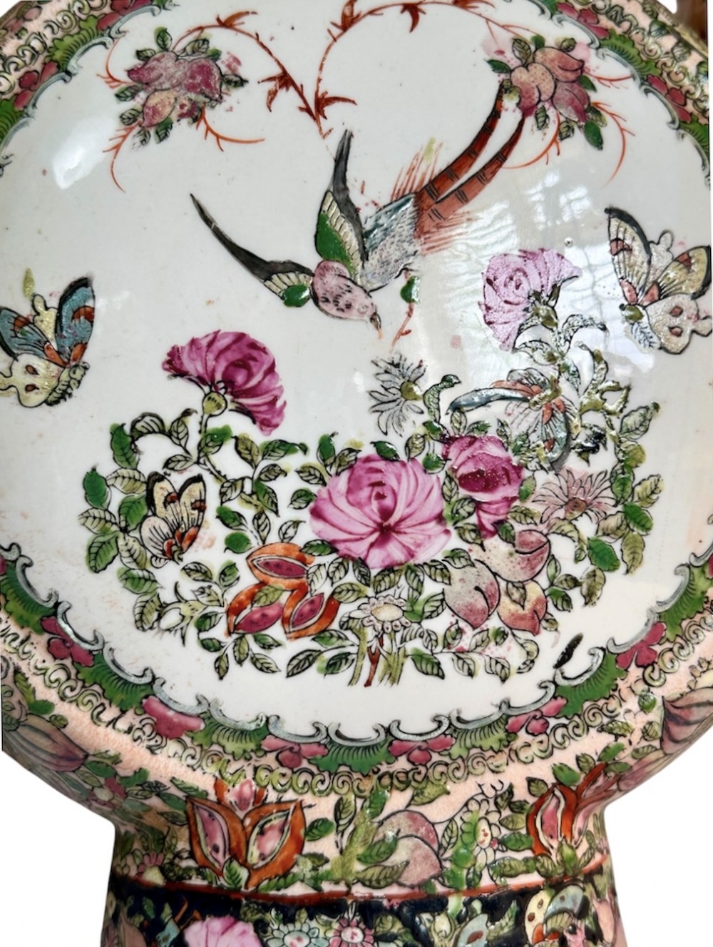 A pair of Chinese Famille Rose porcelain moon flasks featuring circular reserves with painted bird, floral, and figure scenes surrounded by dense enamel borders and dragons. View V