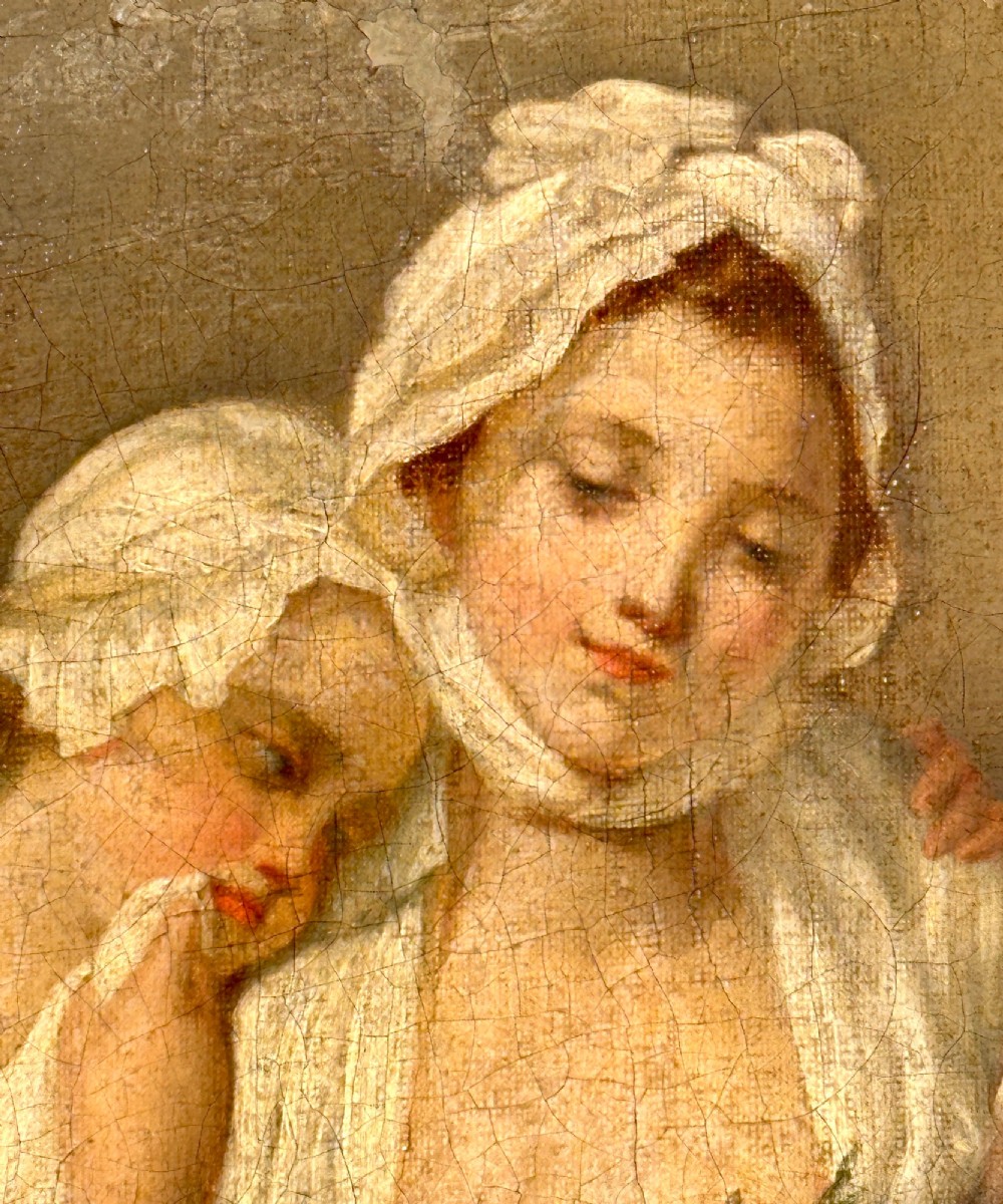 An 18th-century oil painting on canvas depicting two women in period costume within an oval painted border, housed in a carved gilded frame. View II