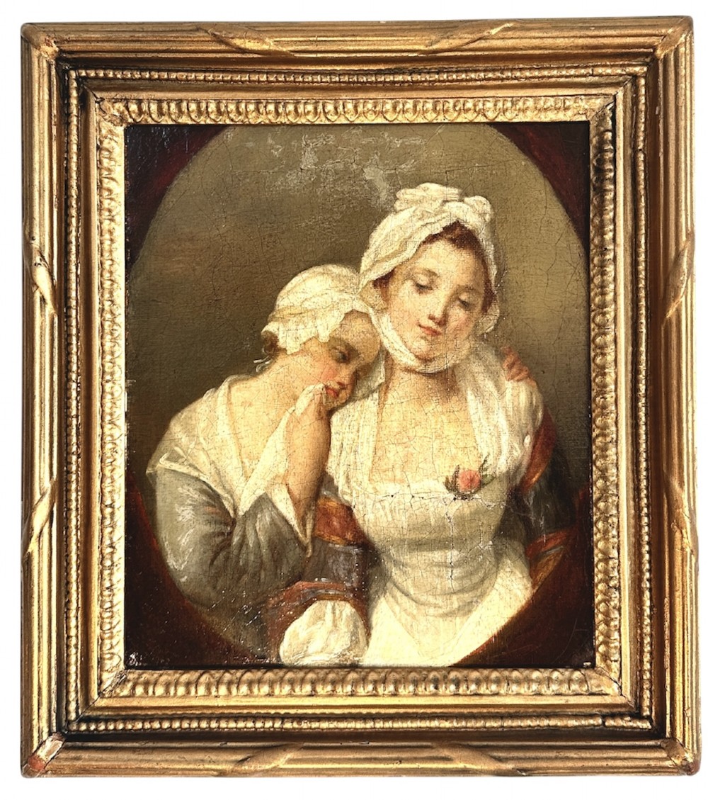 An 18th-century oil painting on canvas depicting two women in period costume within an oval painted border, housed in a carved gilded frame.