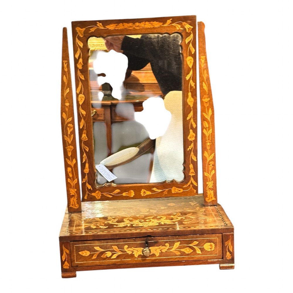 An antique Dutch walnut dressing table mirror featuring intricate floral marquetry inlay across the frame, support posts, and single-drawer base. View II