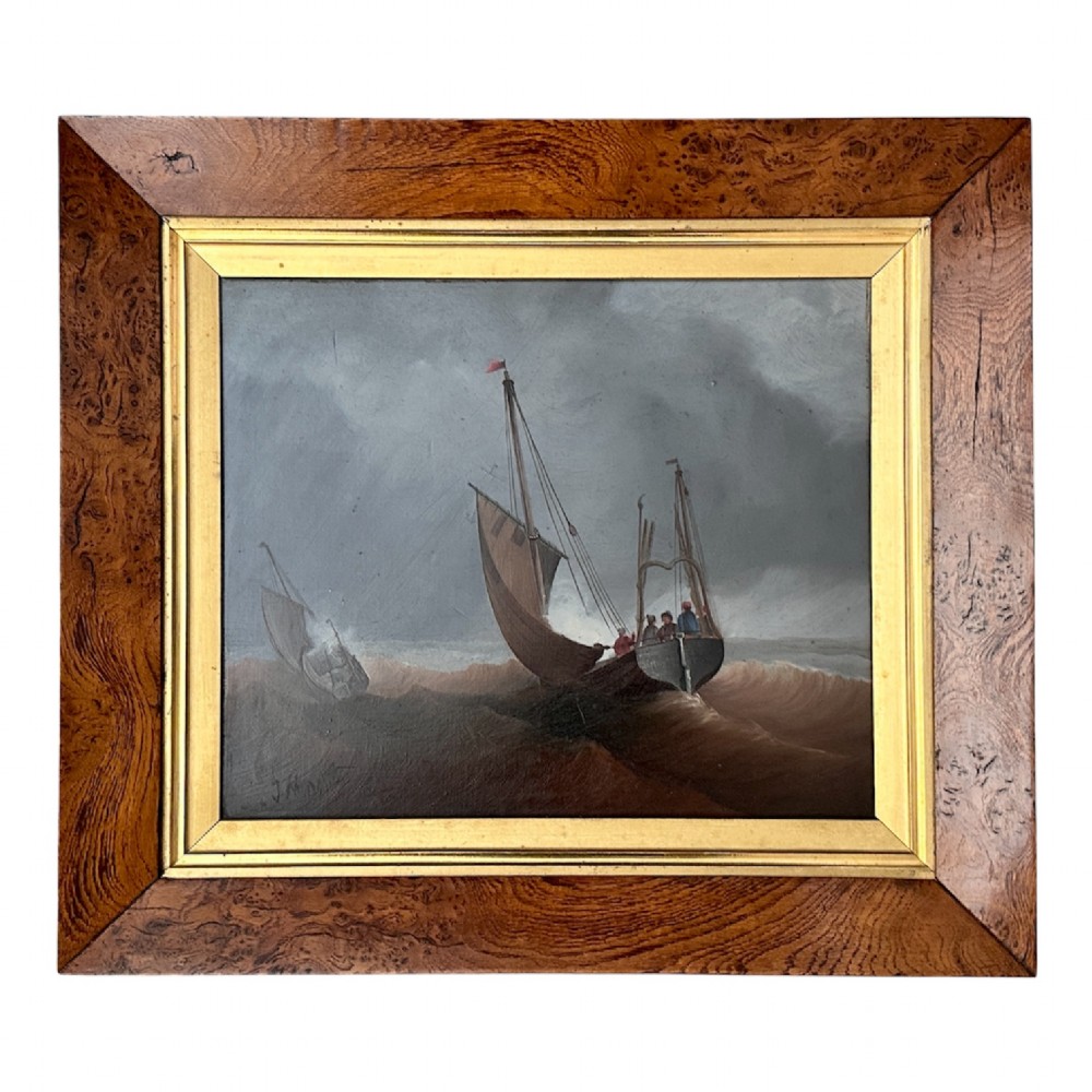 A pair of Victorian marine oil paintings depicting sailing boats navigating choppy seas, encased in wide burr wood frames with gilded slips. View IX
