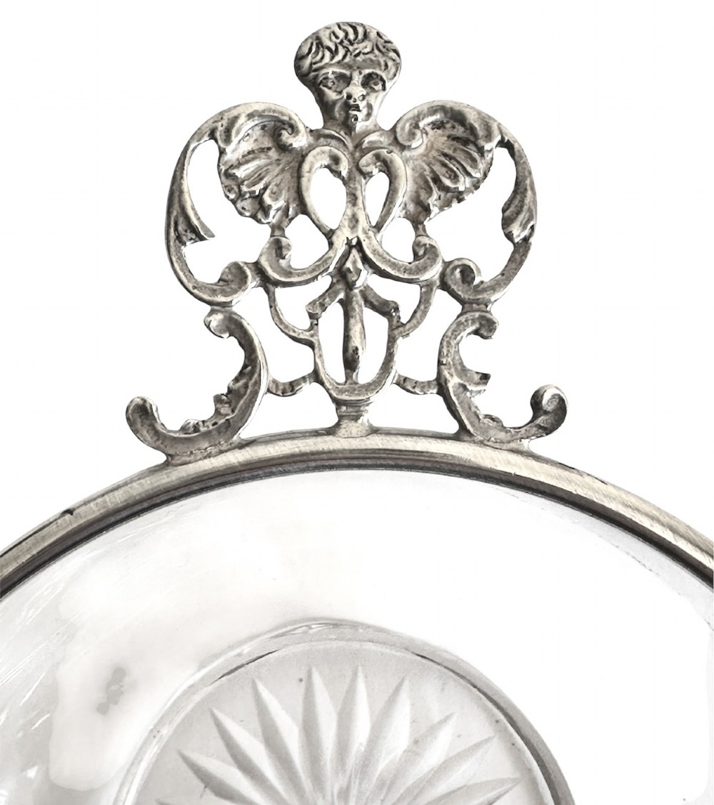 A set of three clear glass bowls featuring sterling silver rims and pierced scroll handles. View III
