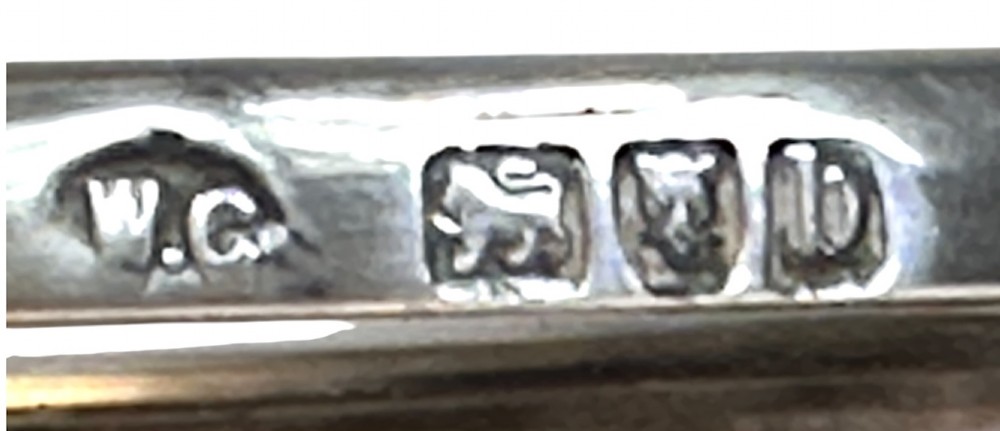 A set of three clear glass bowls featuring sterling silver rims and pierced scroll handles. View IX