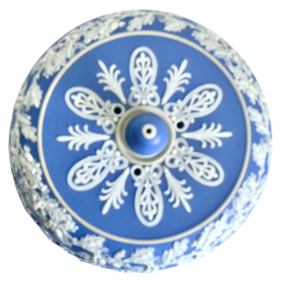A Victorian blue Jasperware cheese dome and base decorated with white neoclassical figures, oak leaf garlands, and a central finial handle. View IV