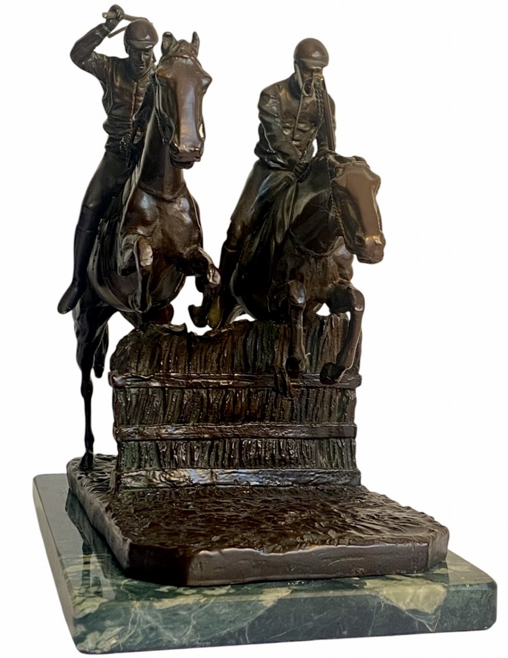 A dark brown bronze sculpture depicting two racehorses and jockeys clearing a fence during a steeplechase, mounted on a polished green marble base. View III
