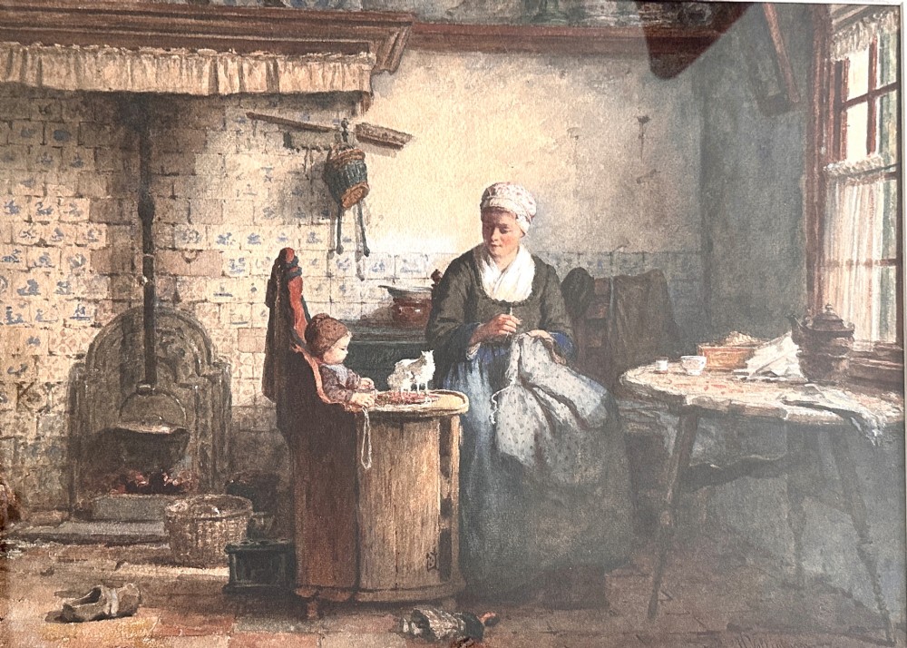A framed 19th-century watercolour painting depicting a woman seated beside a child in a traditional Dutch kitchen interior with a tiled fireplace. View III