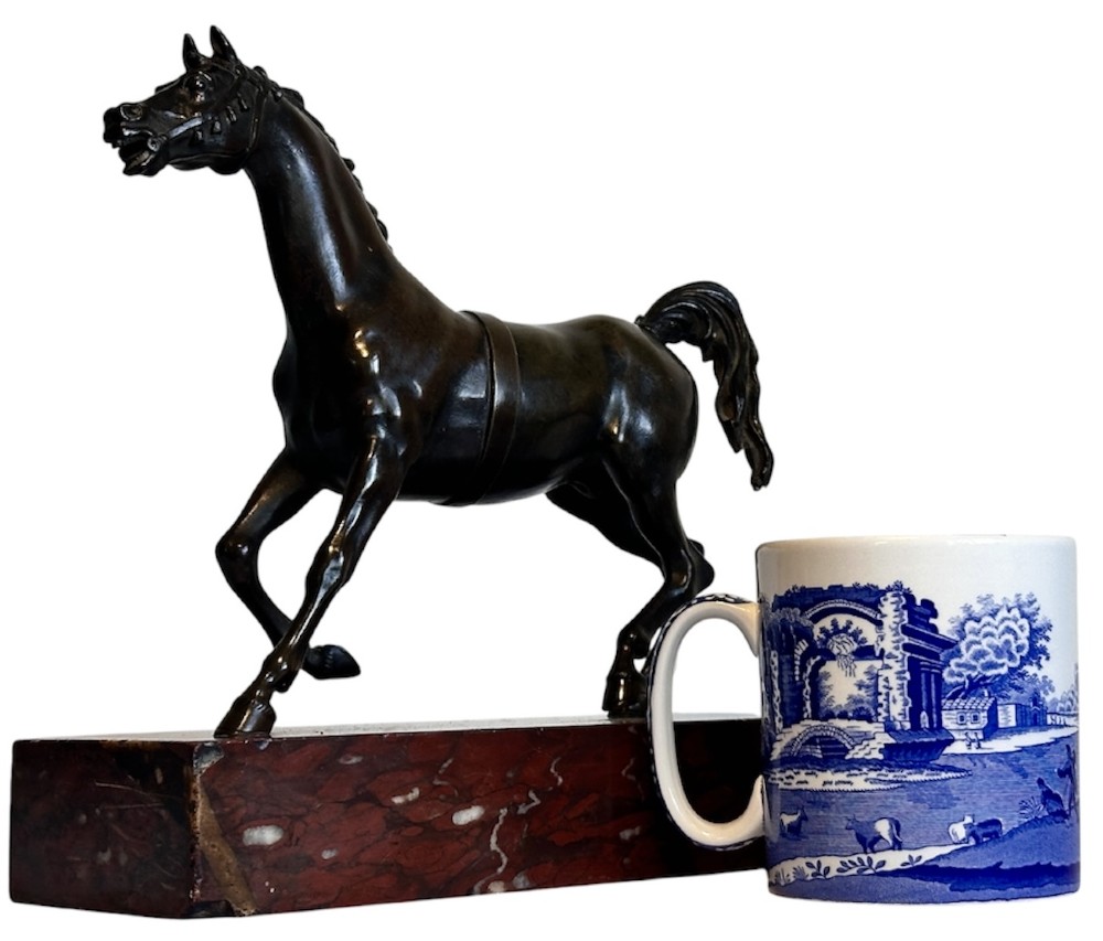 A dark patinated bronze sculpture of a trotting stallion mounted on a rectangular veined red marble plinth. View XI