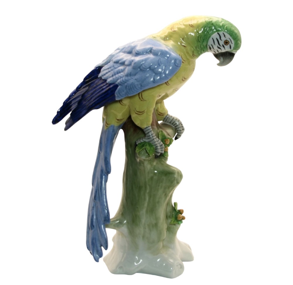 A pair of brightly painted Sitzendorf porcelain parrot figurines perched on textured tree stump bases with leaf accents. View II