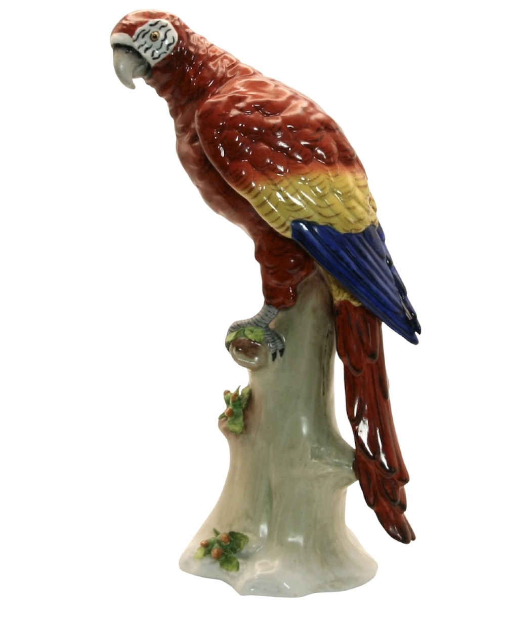 A pair of brightly painted Sitzendorf porcelain parrot figurines perched on textured tree stump bases with leaf accents. View III