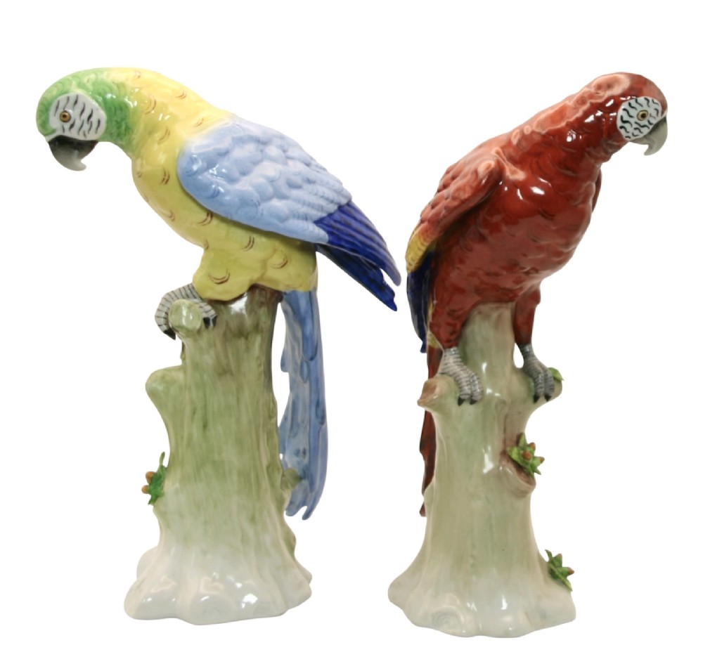 A pair of brightly painted Sitzendorf porcelain parrot figurines perched on textured tree stump bases with leaf accents. View IV