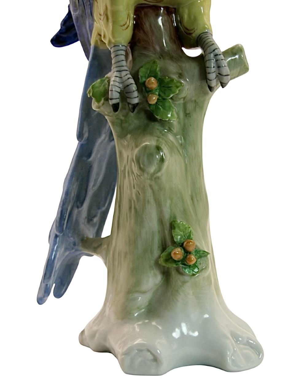 A pair of brightly painted Sitzendorf porcelain parrot figurines perched on textured tree stump bases with leaf accents. View VIII