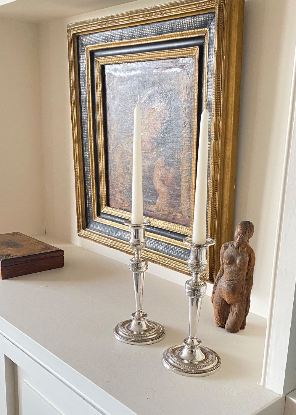 A pair of silver-plated candlesticks with tapered shafts, classical drapery swag motifs, and beaded circular bases. View VI