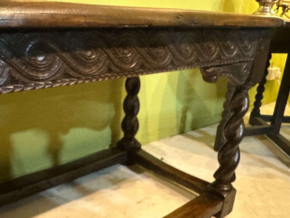 An 18th-century dark oak refectory table featuring carved apron details, spiral barley twist legs, and a perimeter stretcher base. View XIII
