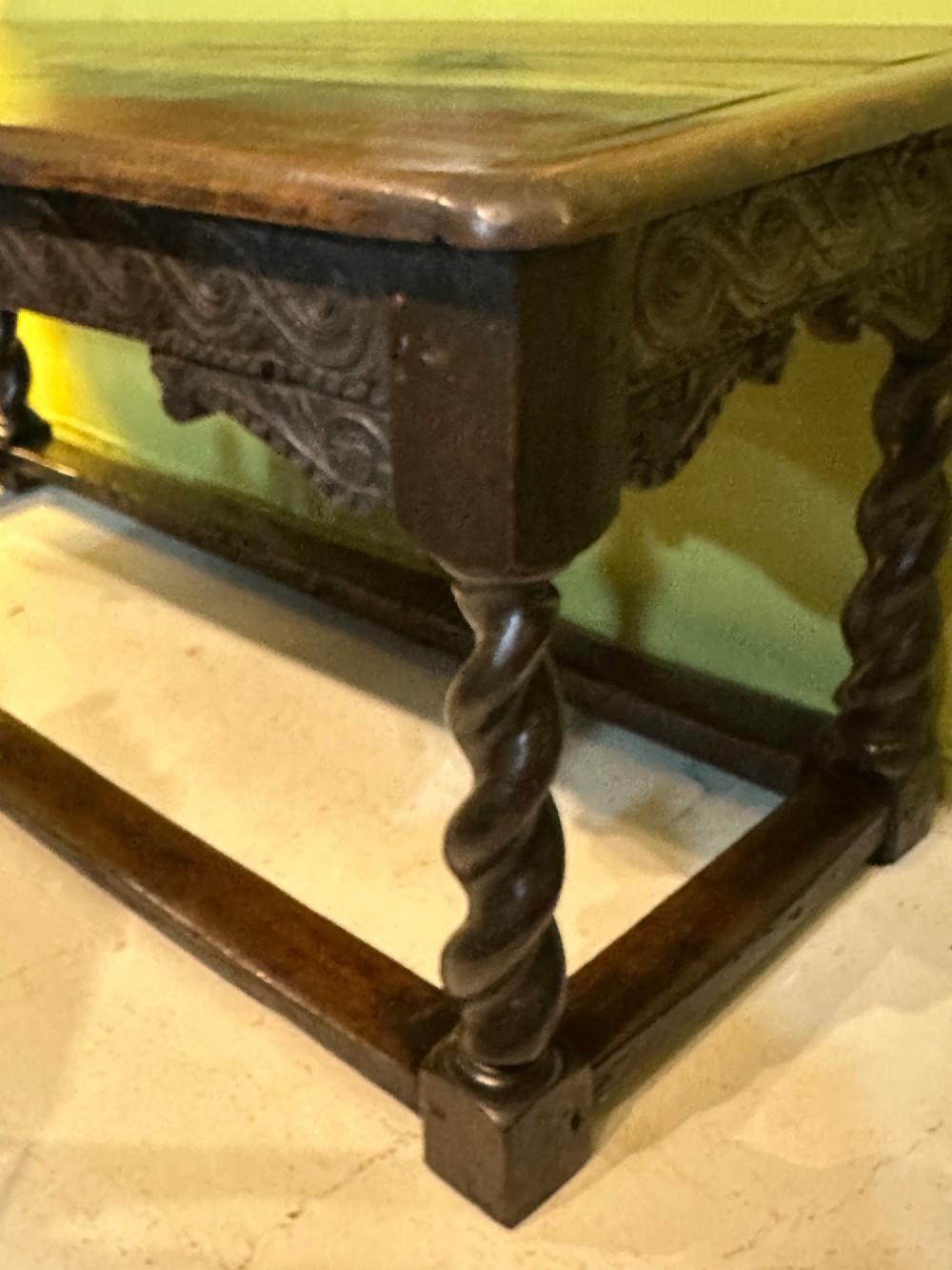 An 18th-century dark oak refectory table featuring carved apron details, spiral barley twist legs, and a perimeter stretcher base. View XIV